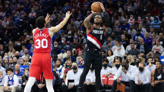 Nov 1, 2021; Philadelphia, Pennsylvania, USA; Portland Trail Blazers guard Damian Lillard (0) shoots in front of Philadelphia 76ers guard Furkan Korkmaz (30) during the second quarter at Wells Fargo Center. Mandatory Credit: Bill Streicher-USA TODAY Sports